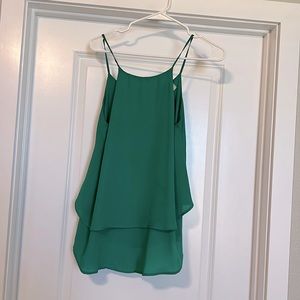 Emerald green tank top with cross back detail. Very flowy with 2 layers.